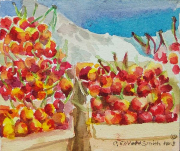 baskets of rainier cherries on table